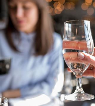 Girl Tasting Water in Glass