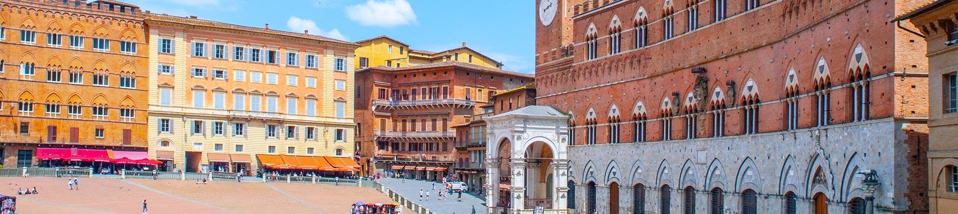 historical buildings surrounding piazza in tuscany