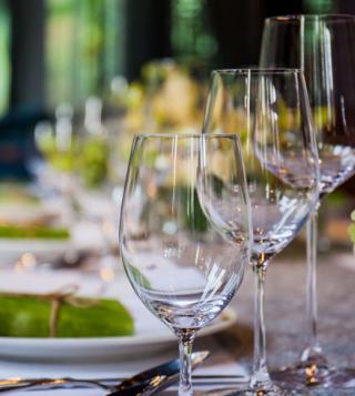 elegant table set with wine and water glasses