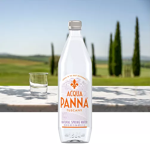green tuscan hills with 1 liter acqua panna water bottle